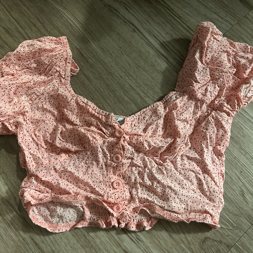 pink crop top with buttons and puff sleeves
